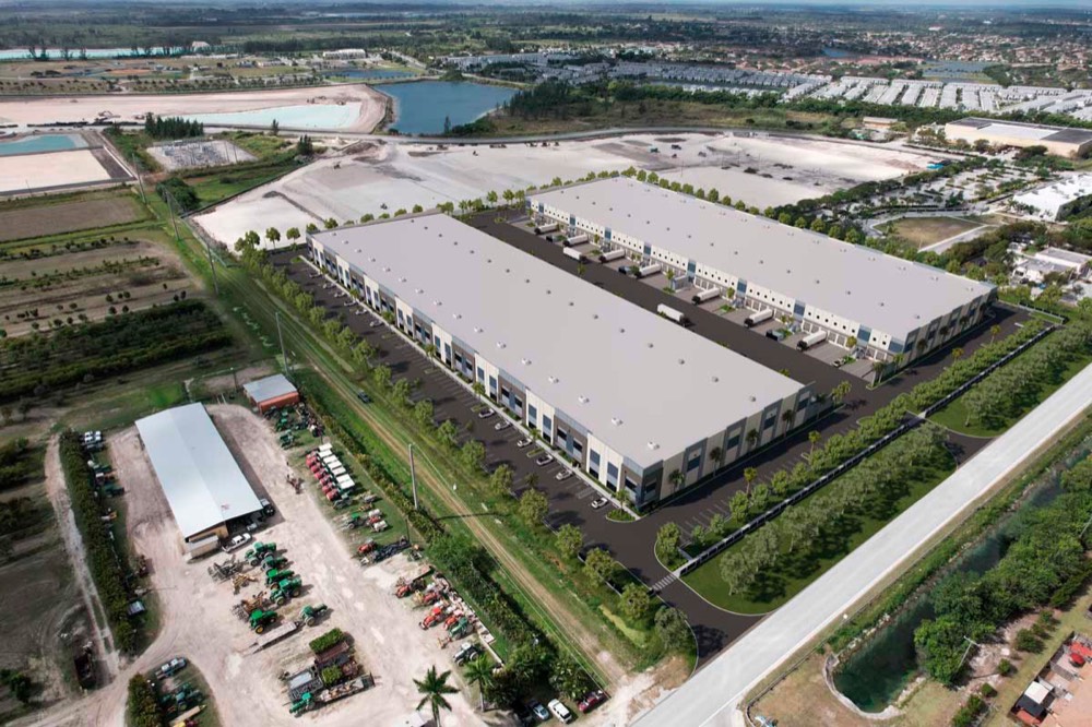 Aerial rendering of two long warehouse buildings with rows of truck loading docks and parking.